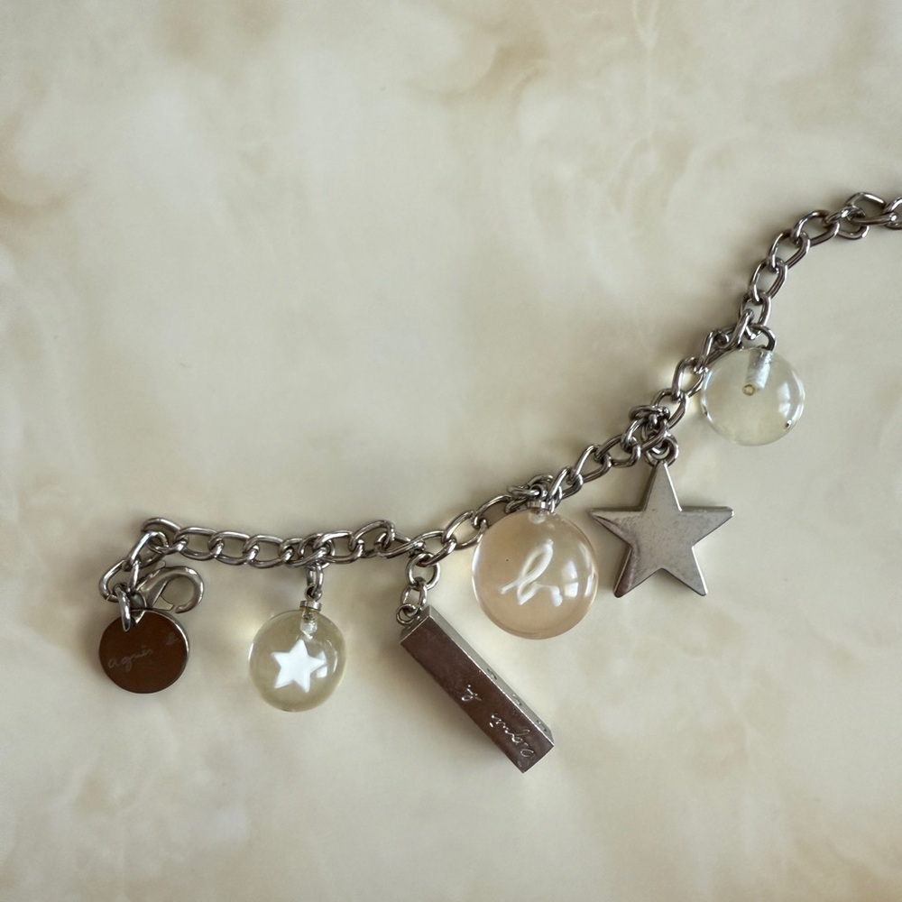 agnès b. Voyage Silver Charm Bracelet – Star, Beads & Logo Accents